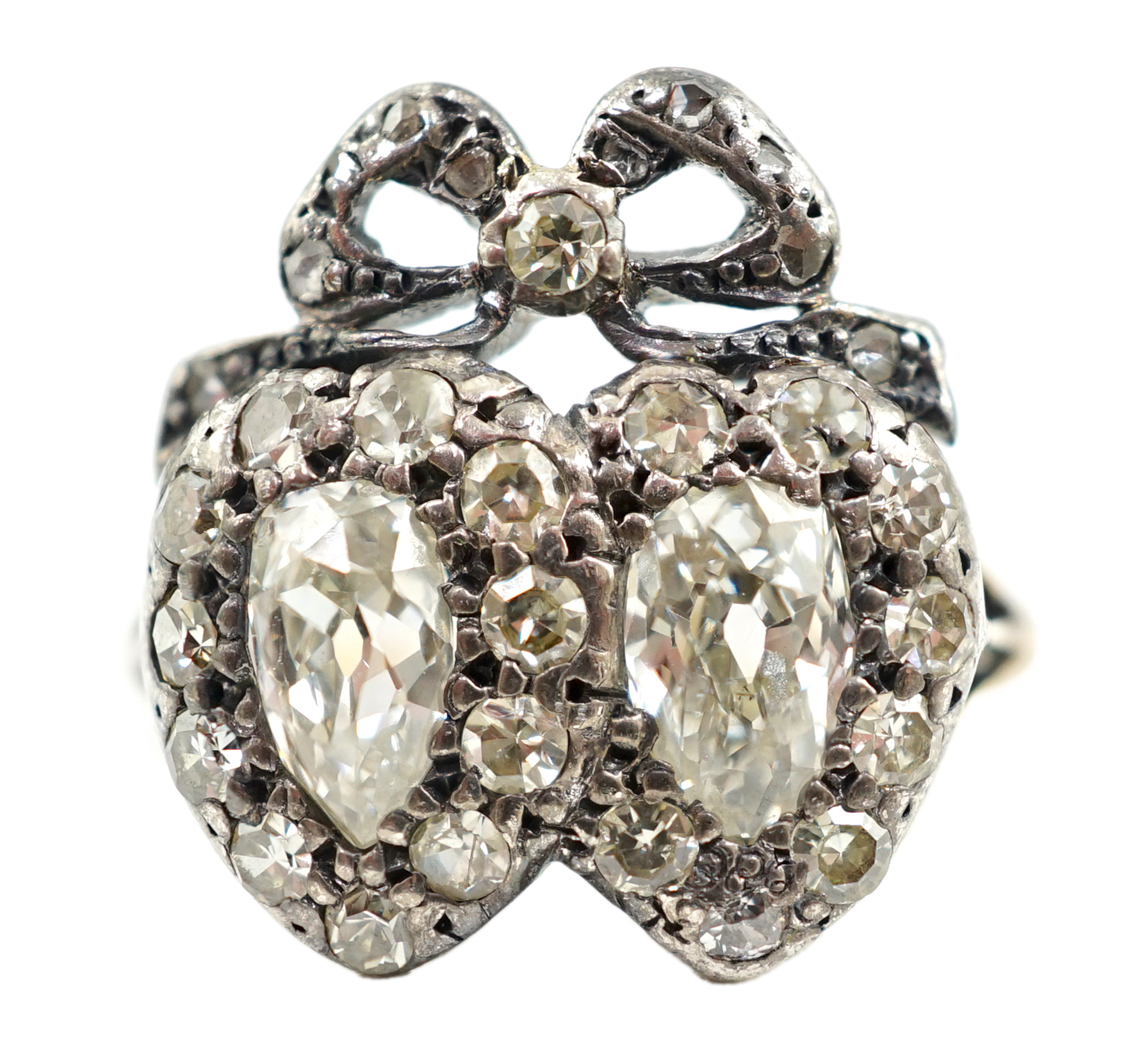 A 19th century gold, silver and diamond cluster set twin hearts ring, with ribbon bow surmounted
